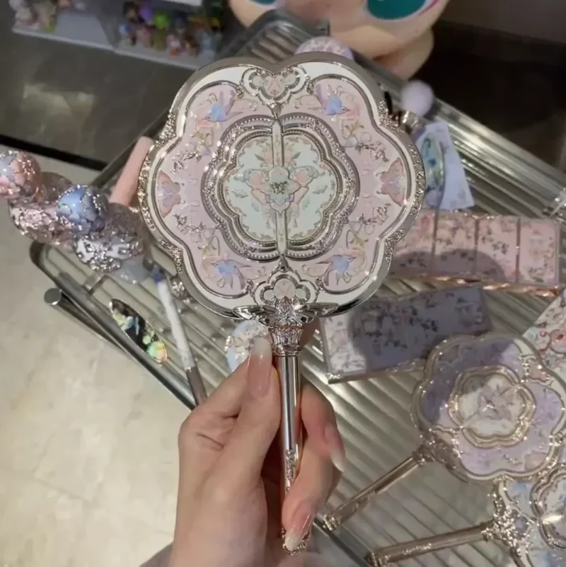 Miroir de poche vintage 18 cm en métal rose avec manche sculpté