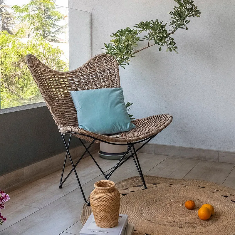 Contemporary Scandinavian Handwoven Rattan Lounge Chair - Accent Chair With Ergonomic Backrest & Iron Base For Boutique Indoor & Outdoor Spaces